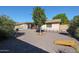 Gravel backyard has a covered patio, in ground pool, and a cornhole game area at 2810 S Emerson --, Mesa, AZ 85210