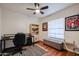 Bedroom featuring a ceiling fan, wood flooring, and desk at 2810 S Emerson --, Mesa, AZ 85210
