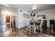 Inviting dining area with a round table, modern chairs, and view of the entryway at 2810 S Emerson --, Mesa, AZ 85210