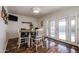 Cozy dining room with a round wooden table, white chairs, and French doors to the patio at 2810 S Emerson --, Mesa, AZ 85210