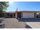 Beautiful one-story brick home boasting mature landscaping and an American flag flying out front at 2810 S Emerson --, Mesa, AZ 85210