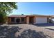 Charming single-story brick home with a well-maintained gravel front yard and an attached two-car garage at 2810 S Emerson --, Mesa, AZ 85210