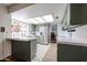 Bright kitchen with green cabinets, stainless steel appliances, and tile countertops at 2810 S Emerson --, Mesa, AZ 85210