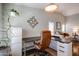 Home office space with a desk, chair, file cabinet, and a view into the living room at 2810 S Emerson --, Mesa, AZ 85210