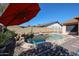 This beautiful in-ground pool features a rock waterfall feature in a fenced yard at 2810 S Emerson --, Mesa, AZ 85210