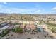 Expansive aerial view of a residential neighborhood with well-maintained homes and mountain views in the distance at 29081 N Cactus Cir, San Tan Valley, AZ 85143