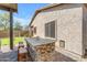 A built-in stone barbecue is a highlight of the backyard at 29081 N Cactus Cir, San Tan Valley, AZ 85143