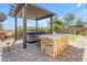 Backyard includes a covered hot tub with a barbecue at 29081 N Cactus Cir, San Tan Valley, AZ 85143