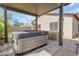 The covered patio includes a hot tub and a built-in barbecue at 29081 N Cactus Cir, San Tan Valley, AZ 85143