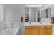 Bright bathroom with double sinks, and a tub/shower combination at 29081 N Cactus Cir, San Tan Valley, AZ 85143