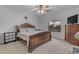 Bedroom features a king-sized bed and dresser with TV at 29081 N Cactus Cir, San Tan Valley, AZ 85143