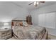 Bedroom with a patterned bedspread and a nightstand with lamp at 29081 N Cactus Cir, San Tan Valley, AZ 85143