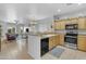 Open concept kitchen featuring wooden cabinets, stainless steel appliances, and tiled floors at 29081 N Cactus Cir, San Tan Valley, AZ 85143