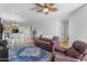Bright, open-plan living room featuring hardwood floors and ceiling fan at 29081 N Cactus Cir, San Tan Valley, AZ 85143