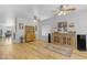 Bright living room with hardwood floors, stylish furnishings and ceiling fans at 29081 N Cactus Cir, San Tan Valley, AZ 85143