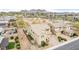 Aerial view of a home with desert landscaping, community features, and mountain views in a Primary-planned community at 2926 W Thorn Tree Dr, Phoenix, AZ 85085