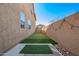 Backyard featuring a putting green, string lights, and a well-maintained landscape, perfect for outdoor fun at 2926 W Thorn Tree Dr, Phoenix, AZ 85085