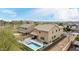 Aerial view showcasing a private backyard with a sparkling pool and outdoor living area in a desert setting at 2926 W Thorn Tree Dr, Phoenix, AZ 85085