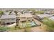 Aerial shot of backyard featuring a refreshing pool, manicured lawn, and covered patio perfect for outdoor relaxation at 2926 W Thorn Tree Dr, Phoenix, AZ 85085