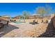 Inviting backyard featuring a sparkling pool, outdoor seating, and lush desert landscaping at 2926 W Thorn Tree Dr, Phoenix, AZ 85085