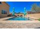 Backyard pool showcasing the clear blue water, complemented by ample patio space and vibrant landscaping at 2926 W Thorn Tree Dr, Phoenix, AZ 85085