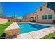 Backyard pool offering a refreshing escape, enhanced by comfortable seating and serene surroundings at 2926 W Thorn Tree Dr, Phoenix, AZ 85085