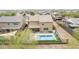 Aerial view of backyard with a sparkling pool and outdoor seating area, perfect for entertaining and relaxation at 2926 W Thorn Tree Dr, Phoenix, AZ 85085