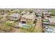Aerial view of backyard showcasing pool, patio with seating, and artificial turf, ideal for outdoor living at 2926 W Thorn Tree Dr, Phoenix, AZ 85085