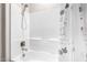 Clean white bathtub and shower with brushed nickel fixtures and cute shower curtain at 2926 W Thorn Tree Dr, Phoenix, AZ 85085