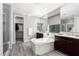 Luxurious bathroom with a soaking tub, dual vanities, modern fixtures, and a walk-in shower at 2926 W Thorn Tree Dr, Phoenix, AZ 85085