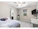 Bedroom with large windows and a connected ensuite bath with a view to the outside at 2926 W Thorn Tree Dr, Phoenix, AZ 85085
