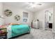 Bright bedroom features updated ceiling fan, neutral paint, and bright window views at 2926 W Thorn Tree Dr, Phoenix, AZ 85085
