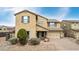 Charming two-story home showcasing a well-manicured front yard and attached two-car garage at 2926 W Thorn Tree Dr, Phoenix, AZ 85085