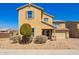 Charming two-story home showcasing low-maintenance desert landscaping and a brick paver driveway at 2926 W Thorn Tree Dr, Phoenix, AZ 85085