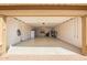 Spacious garage with epoxy floor coating, ample storage, and utility sink at 2926 W Thorn Tree Dr, Phoenix, AZ 85085