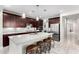 Spacious kitchen featuring a large island with seating, stainless steel appliances, and modern finishes at 2926 W Thorn Tree Dr, Phoenix, AZ 85085