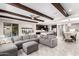 Open-concept living room featuring a sectional sofa, and seamless flow to the kitchen and dining area at 2926 W Thorn Tree Dr, Phoenix, AZ 85085