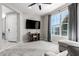 Comfortable living room with abundant natural light, plush carpeting and a ceiling fan at 2926 W Thorn Tree Dr, Phoenix, AZ 85085