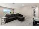 Spacious loft area featuring a large sectional sofa and plentiful plants for added brightness at 2926 W Thorn Tree Dr, Phoenix, AZ 85085