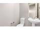 Elegant powder room with pedestal sink and modern fixtures at 2926 W Thorn Tree Dr, Phoenix, AZ 85085