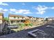 A backyard featuring artificial turf, a trampoline, and a playground area designed for enjoyment and recreation at 29374 N 125Th Dr, Peoria, AZ 85383