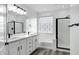 Bathroom features dual sink vanity, soaking tub and glass block window at 29374 N 125Th Dr, Peoria, AZ 85383