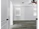 Bright bedroom features sleek wood flooring, ceiling fan and mini-blinds at 29374 N 125Th Dr, Peoria, AZ 85383