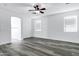 Bright bedroom features sleek wood flooring and mini-blinds at 29374 N 125Th Dr, Peoria, AZ 85383