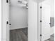 An empty bedroom with a ceiling fan and gray floors at 29374 N 125Th Dr, Peoria, AZ 85383