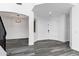 Welcoming entryway featuring gray modern flooring, neutral walls, and an open floor plan at 29374 N 125Th Dr, Peoria, AZ 85383