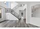 Spacious entryway featuring a staircase with wrought iron railings and contemporary flooring at 29374 N 125Th Dr, Peoria, AZ 85383