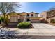 Charming two-story home with stone accents, a well manicured yard, and mature landscaping at 29374 N 125Th Dr, Peoria, AZ 85383