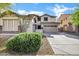 Charming two-story home featuring desert landscaping and a spacious driveway at 29374 N 125Th Dr, Peoria, AZ 85383