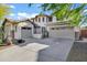 Stunning two-story home with a three-car garage and an inviting front entrance at 29374 N 125Th Dr, Peoria, AZ 85383